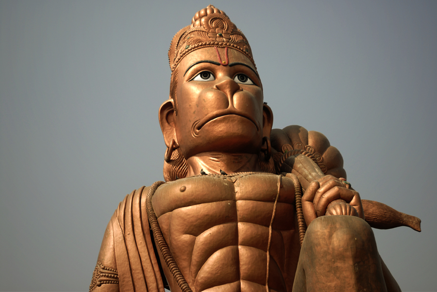 In this picture a statue of Hanuman has been photographed in Haryana in India. Hanuman Ji is also called as 'Anjaneya', 'Bajrangbali', 'Mahavir' and worshiped by millions of devotees in India for his courage, bravery and strength. There are numerous temples for Hanuman in India and most of the idols of Lord Hanuman are found on mountain roads to protect people.
