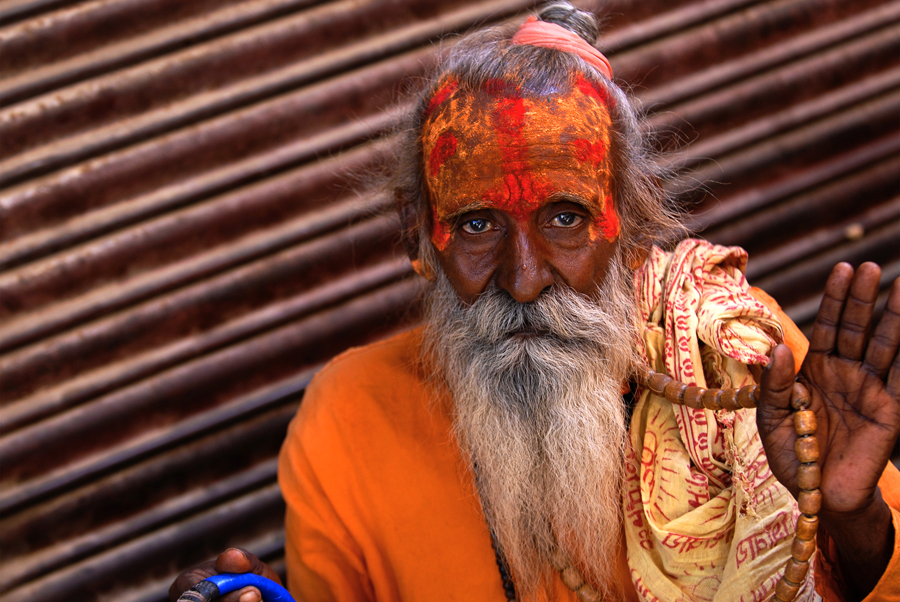 Found throughout India, they are seen in towns and cities and walking along roads with begging pots and staffs. They are respected by Hindus and given food in return for their blessings and prayers and they are also known as 'Babas'. 'Sadhus' are wandering ascetics affiliated with a wide range of Hindu religious orders and schools as seen in this photograph from Pushkar in Rajasthan.
