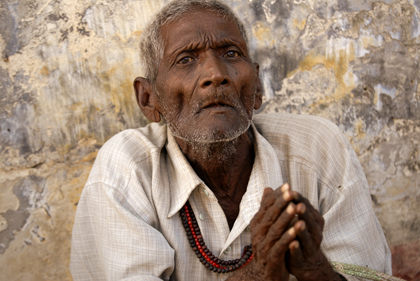 Poverty is one of the conditions of life in India. This wrinkled man was submissively trying to beg a few rupees from the neverending passing people in Uttar Pradesh's Sarnath near Varanasi. Read about the man in this story.