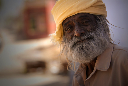 There was a poetic sense almost like a troubadour over this Indian man that has been photographed during the morning hours in the holy pilgrimage town of Pushkar. Read more about troubadours, poets and poetry in this archive story.