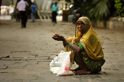 In India, countless people grow up in extreme poverty and they live in bitterly poor rural regions or in the huge slums of the megacities such as with this Indian street beggar photographed in Mumbai.  Read more about these beggars in this archive story.