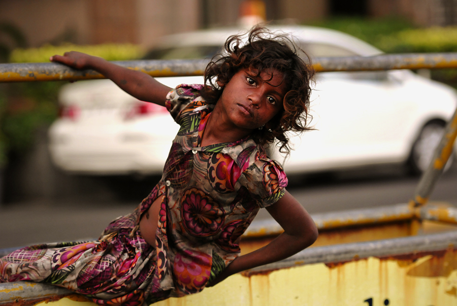 Street children in the classical sense are found in India almost without exception in the cities with a population of approximately 50,000 inhabitants. The photographer had to get use to begging street children everywhere in Mumbai. At the PJ Ramchandani Marg in Mumbai just near the prestigious The Taj Mahal Palace this Mumbai street child was photographed.