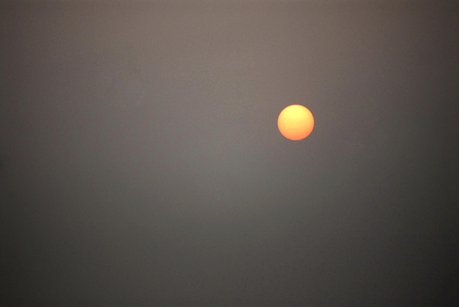 Sunrise or Sun up is the instant at which the upper edge of the Sun appears over the horizon in the morning as seen in this photograph by the photographer from Varanasi in India. The term can also refer to the entire process of the sun crossing the horizon and its accompanying atmospheric effects and in religions such as Hinduism it is still considered a god in India.